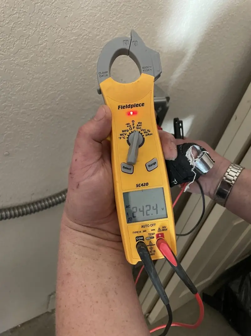 Voltage testing with clamp meter during Whole House Surge Protector in Wooster
